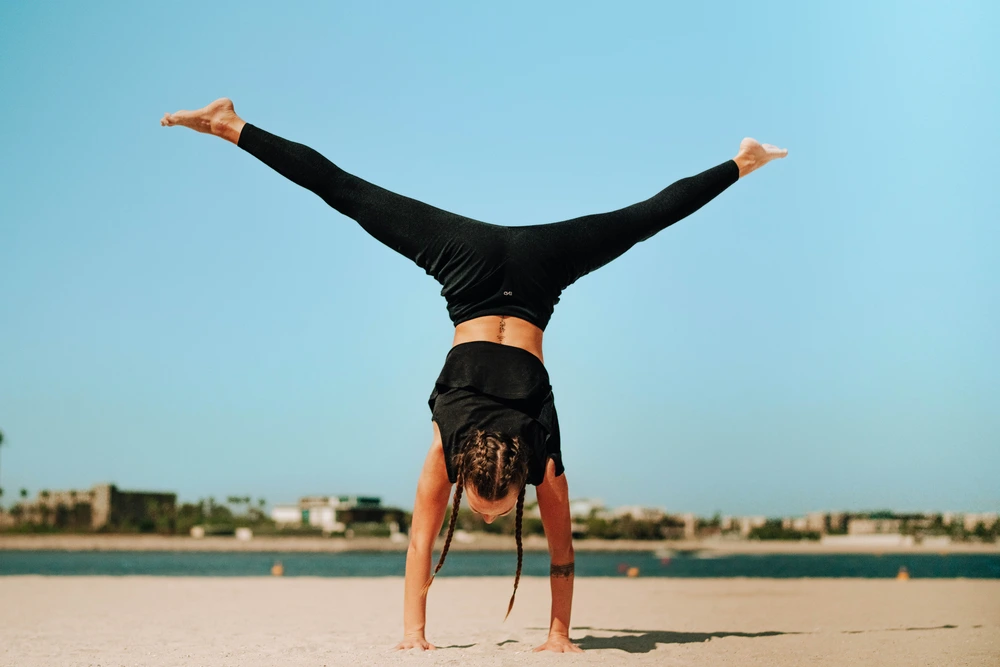 Two women running together on forest trail, showcasing natural movement and community connection in nature